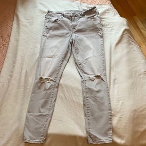 Old Navy Rockstar mid-rise skinny jeans with rips in knees